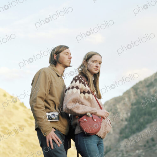 Young couple standing in a canyon. Young couple standing in a canyon.