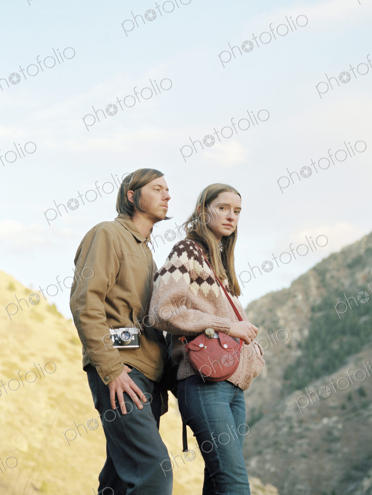 Young couple standing in a canyon.