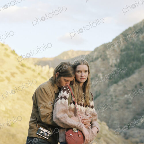 Young couple standing in a canyon. Young couple standing in a canyon.