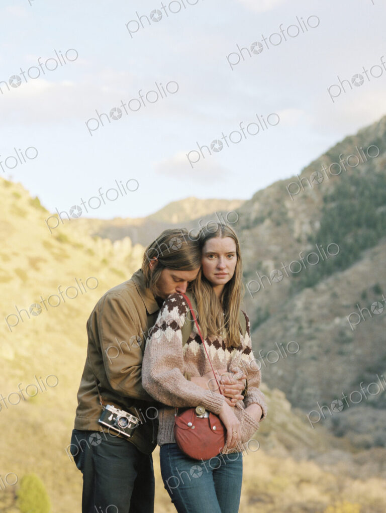 Young couple standing in a canyon.